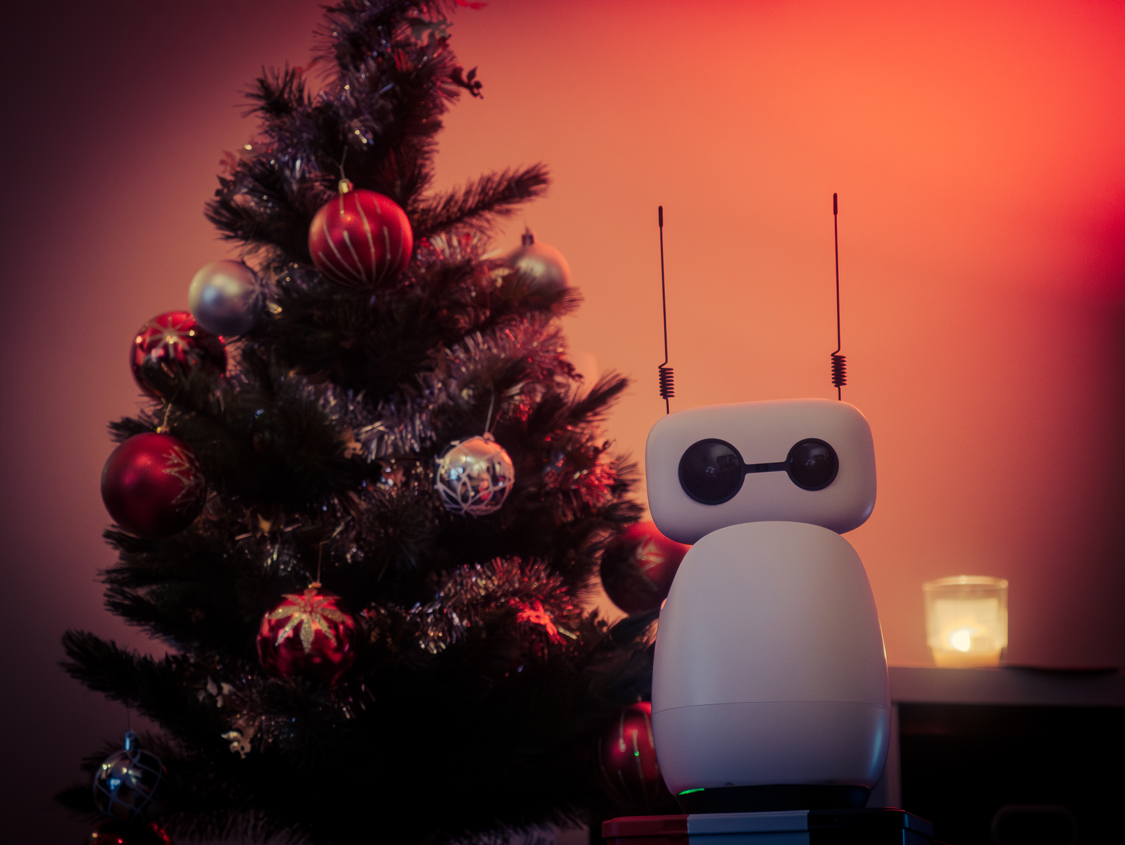 Reachy Mini next to the Christmas tree